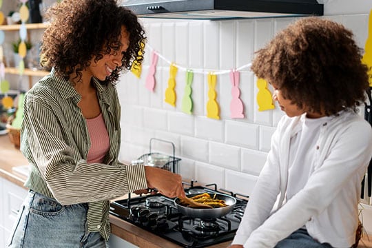 Family cooking together in a modern kitchen